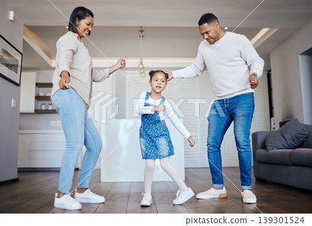 Dance, love and freedom with an interracial family having fun in the living room of their home together. Energy, smile or happy with a mother, father and excited daughter moving in their apartment Dance, love and freedom with an interracial family having fun in the living room of their home together. Energy, smile or happy with a mother, father and excited daughter moving in their apartment 139301524
