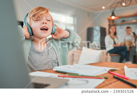Child, headphones and homework or music sing at laptop for distance learning, virtual class or notebook. Kid, academic work break in family home for entertainment playlist, relax or education rest Child, headphones and homework or music sing at laptop for distance learning, virtual class or notebook. Kid, academic work break in family home for entertainment playlist, relax or education rest 139301526