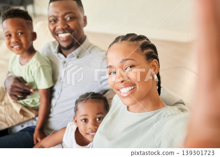 Selfie, happy family and children in home for social media, profile picture or post. Black people, little girl and boy with smile in excitement for memory, bonding and together on sofa in living room Selfie, happy family and children in home for social media, profile picture or post. Black people, little girl and boy with smile in excitement for memory, bonding and together on sofa in living room 139301723