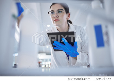 Woman, medical scientist and tablet in lab for test results check, future trial or science solution. Female person, digital device and thinking or review breakthrough hope, idea in biotechnology 139301866