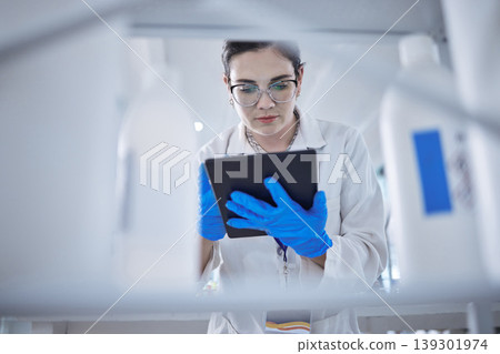 Woman, medical research and tablet in lab for test results check, future pill trial or science study. Female person, digital device and report or review breakthrough hope, idea in work biotechnology Woman, medical research and tablet in lab for test results check, future pill trial or science study. Female person, digital device and report or review breakthrough hope, idea in work biotechnology 139301974