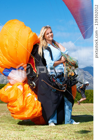 Parachute, sport or woman in nature for portrait, smile or strings for exercise for flight preparation. Athlete, face or happy with travel for outdoor wellness, helmet or equipment in countryside Parachute, sport or woman in nature for portrait, smile or strings for exercise for flight preparation. Athlete, face or happy with travel for outdoor wellness, helmet or equipment in countryside 139302012