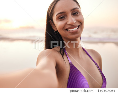 Selfie, happy and portrait of woman by beach for summer holiday, vacation and relax on weekend. Travel, swimsuit and face of person take picture for social media, online post and memory by ocean Selfie, happy and portrait of woman by beach for summer holiday, vacation and relax on weekend. Travel, swimsuit and face of person take picture for social media, online post and memory by ocean 139302064