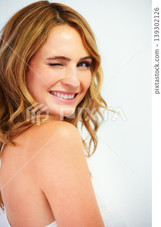 Woman, smiling and portrait with wink, skincare and cosmetics with pose, confident and face. Skin, foundation and glow with hair, eyes and young model for cosmetology, dermatology and beautiful Woman, smiling and portrait with wink, skincare and cosmetics with pose, confident and face. Skin, foundation and glow with hair, eyes and young model for cosmetology, dermatology and beautiful 139302126