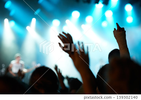 Crowd silhouette, music artist and concert audience listen to song, stage performance or celebrity rock star. Night event hands, rave festival show or excited group, fans or crazy cheers for musician Crowd silhouette, music artist and concert audience listen to song, stage performance or celebrity rock star. Night event hands, rave festival show or excited group, fans or crazy cheers for musician 139302140