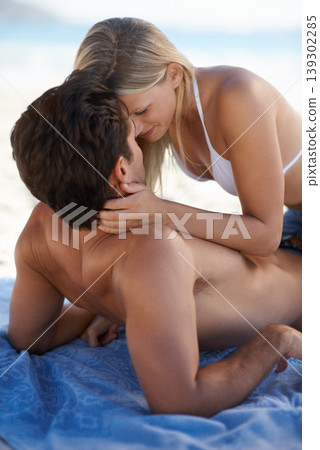 Beach, couple and embrace with love, support and care on holiday by the sea and ocean. Romance, bonding and kiss with young people together on vacation adventure on sand about to kiss on a date Beach, couple and embrace with love, support and care on holiday by the sea and ocean. Romance, bonding and kiss with young people together on vacation adventure on sand about to kiss on a date 139302285