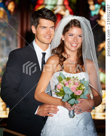 Happy couple, wedding and bouquet of flowers at church for marriage, love or commitment at ceremony. Married man and woman smile with floral roses and bridal dress for relationship or celebration Happy couple, wedding and bouquet of flowers at church for marriage, love or commitment at ceremony. Married man and woman smile with floral roses and bridal dress for relationship or celebration 139302287