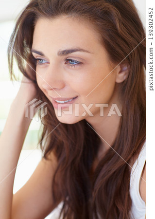 Smile, thinking and face of woman in morning, wake up and natural wellness in home on calm summer weekend. Relax, healthy rest and peace for happy girl in bedroom of apartment, hotel room or house. 139302452