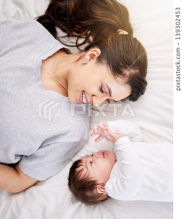 Mother, baby and bed with love and care or security with smile or bond in comfort and peace. A woman or mom and infant child in a bedroom for safety in a family home for growth, above and connection Mother, baby and bed with love and care or security with smile or bond in comfort and peace. A woman or mom and infant child in a bedroom for safety in a family home for growth, above and connection 139302453