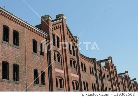 The retro brick exterior of Yokohama Red Brick Warehouse stands out against the blue sky. The retro brick exterior of Yokohama Red Brick Warehouse stands out against the blue sky. 139302508