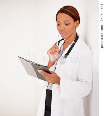 Woman, doctor thinking and medical charts for hospital schedule, management or results with solution or idea. African person reading of healthcare checklist, clipboard or folder on a wall background Woman, doctor thinking and medical charts for hospital schedule, management or results with solution or idea. African person reading of healthcare checklist, clipboard or folder on a wall background 139302521