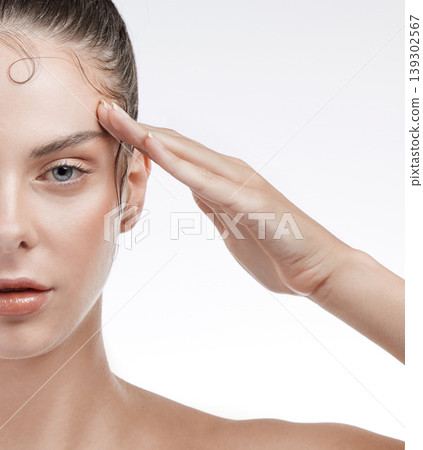 Portrait, woman and face with closeup in studio on white background for beauty mock up. Female model, salute and serious expression for self care, edges and treatment for health, glow and texture Portrait, woman and face with closeup in studio on white background for beauty mock up. Female model, salute and serious expression for self care, edges and treatment for health, glow and texture 139302567