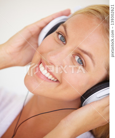 Portrait, happy woman and headphones for listening to music, freedom and wireless in closeup. Female person, face and smile with excitement for technology with podcast, radio or streaming service Portrait, happy woman and headphones for listening to music, freedom and wireless in closeup. Female person, face and smile with excitement for technology with podcast, radio or streaming service 139302621