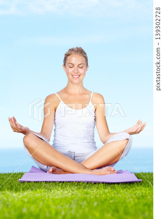 Woman, lotus hands and meditation, peace or calm for mental health, wellness or mindfulness on a blue sky background. Young and zen person smile in park or outdoor for yoga, spiritual care and chakra 139302728