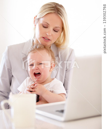 Businesswoman, crying and baby for remote work in home with laptop for multitask, productivity and job. Single mom, toddler and lap for comfort, childcare or love for freelance, development woking 139302768