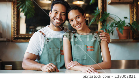 Hug, portrait and smile of couple in coffee shop together for management or store ownership. Hospitality, proud and service with happy people embracing in restaurant cafe for small business startup Hug, portrait and smile of couple in coffee shop together for management or store ownership. Hospitality, proud and service with happy people embracing in restaurant cafe for small business startup 139302821