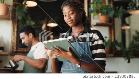 Hospitality, tablet and woman in restaurant, internet and service for online order, email and startup website. Barista, entrepreneur or person in cafe, tech for inventory or planning menu with apron Hospitality, tablet and woman in restaurant, internet and service for online order, email and startup website. Barista, entrepreneur or person in cafe, tech for inventory or planning menu with apron 139302883