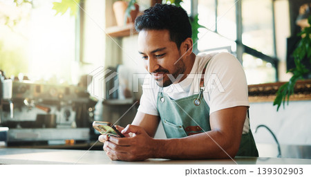 Message, smile and barista in cafe with phone, chat or social media update on work break. Texting, happy or man in restaurant with tech, business review or online communication for networking. Message, smile and barista in cafe with phone, chat or social media update on work break. Texting, happy or man in restaurant with tech, business review or online communication for networking. 139302903