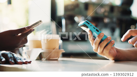 Hands, payment and phone in coffee shop with POS machine, eft transaction and bill for hospitality. People, cashier and customer service in cafe with digital banking, purchase and cashless transfer. Hands, payment and phone in coffee shop with POS machine, eft transaction and bill for hospitality. People, cashier and customer service in cafe with digital banking, purchase and cashless transfer. 139302912