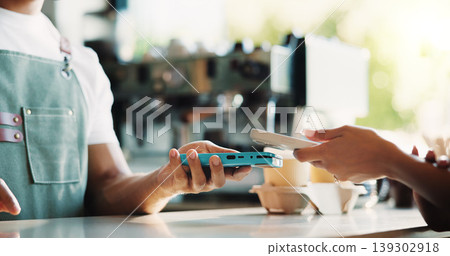 People, hands and phone in coffee shop with POS machine, transaction and bill payment for hospitality. Cashier, customer service and tech in cafe with digital banking, purchase and cashless transfer. People, hands and phone in coffee shop with POS machine, transaction and bill payment for hospitality. Cashier, customer service and tech in cafe with digital banking, purchase and cashless transfer. 139302918