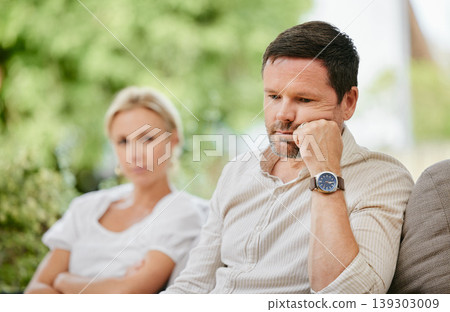 Couple, ignoring and upset on fight, stress and divorce for marriage problems. People, argument and frustrated for silent treatment, couch and anxious or angry, conflict and toxic relationship Couple, ignoring and upset on fight, stress and divorce for marriage problems. People, argument and frustrated for silent treatment, couch and anxious or angry, conflict and toxic relationship 139303009