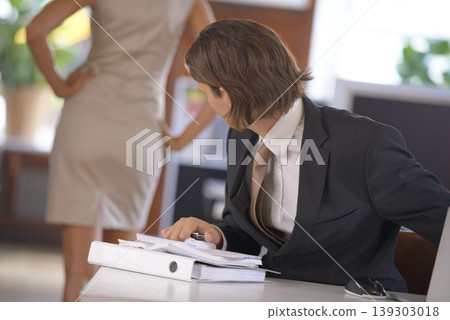 Fantasy, sexual harassment and ethics with a business man in the office with a woman colleague. Infidelity, behavior or misogyny with an employee looking at the back of a coworker in the workplace Fantasy, sexual harassment and ethics with a business man in the office with a woman colleague. Infidelity, behavior or misogyny with an employee looking at the back of a coworker in the workplace 139303018