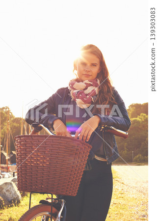 Portrait, summer and a girl with her bicycle in the park for travel, freedom or eco friendly adventure. Flare, cycling and a young person outdoor in the countryside for a cycling ride to relax Portrait, summer and a girl with her bicycle in the park for travel, freedom or eco friendly adventure. Flare, cycling and a young person outdoor in the countryside for a cycling ride to relax 139303083