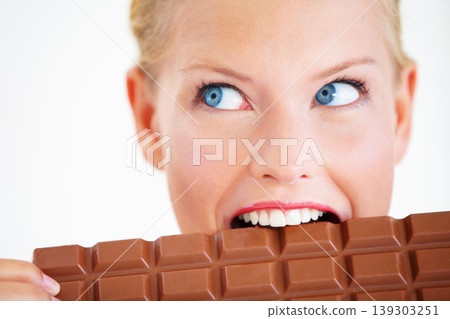 Studio face, woman thinking or eating chocolate bar, delicious snack or idea for candy food, dessert or sugar product. Diet plan, looking or girl bite, taste or enjoy cacao sweets on white background Studio face, woman thinking or eating chocolate bar, delicious snack or idea for candy food, dessert or sugar product. Diet plan, looking or girl bite, taste or enjoy cacao sweets on white background 139303251
