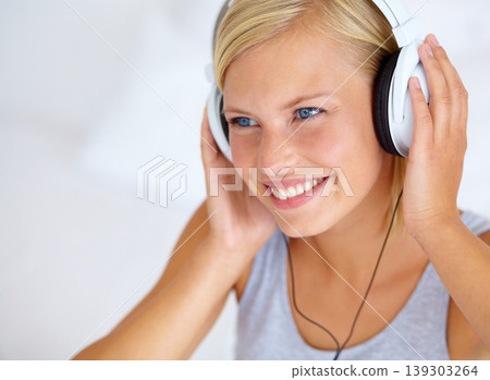 Home, thinking and woman with headphones, streaming music and smile with radio, podcast and listening to audio. Person, apartment or girl with headset, ideas and happiness with sound, joy or cheerful Home, thinking and woman with headphones, streaming music and smile with radio, podcast and listening to audio. Person, apartment or girl with headset, ideas and happiness with sound, joy or cheerful 139303264