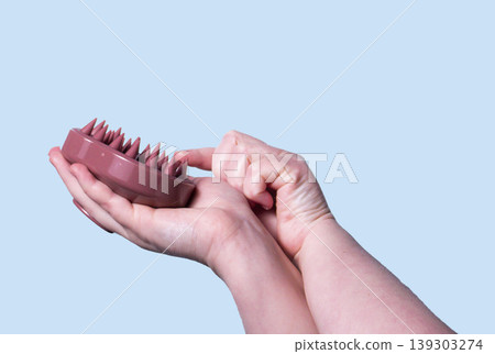 Hair and scalp massager. Device for hair care and treatment. Image for topic about hair growth and beauty salon. Copy space Hair and scalp massager. Device for hair care and treatment. Image for topic about hair growth and beauty salon. Copy space 139303274