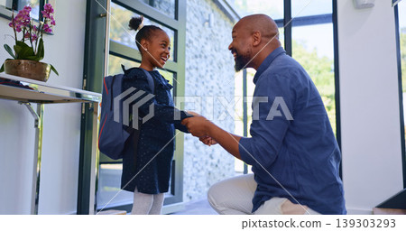 Backpack, hello and father with girl school child in a house for greeting, welcome or bond with love. Happy, black family or student kid with dad in a doorway for conversation, support and security Backpack, hello and father with girl school child in a house for greeting, welcome or bond with love. Happy, black family or student kid with dad in a doorway for conversation, support and security 139303293