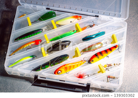 Large fisherman tackle box fully stocked with lures and gear for fishing. Kit of lures and fishing accessories Large fisherman tackle box fully stocked with lures and gear for fishing. Kit of lures and fishing accessories 139303302