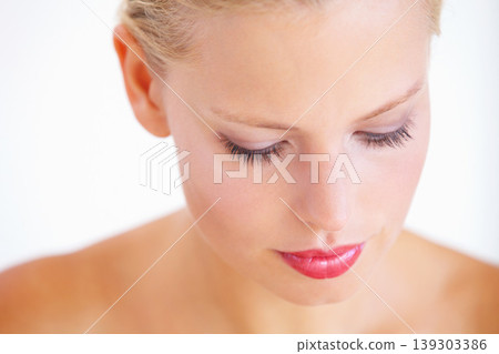 Beauty, studio face and relax woman with facial makeup, skin treatment glow or cosmetics self care routine. Mascara, spa skincare and person with aesthetic anti aging dermatology on white background 139303386