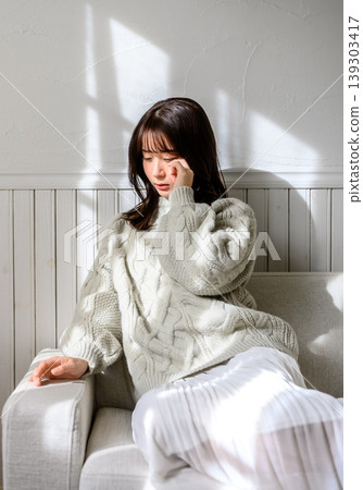 Woman, sweater, sofa Woman, sweater, sofa 139303417