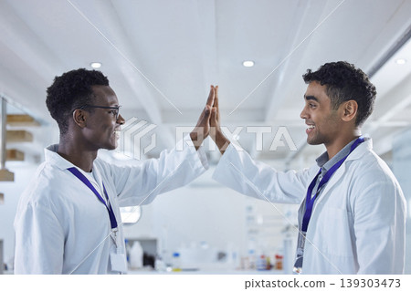 Science, high five and men in laboratory for congratulations, deal or success with results. Teamwork, medical research and celebration, scientist partnership in collaboration or cheers for doctors. Science, high five and men in laboratory for congratulations, deal or success with results. Teamwork, medical research and celebration, scientist partnership in collaboration or cheers for doctors. 139303473