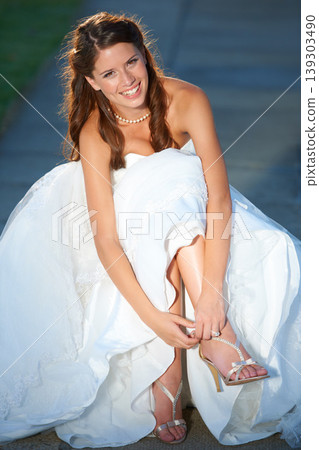 Woman, wedding and feet with portrait, shoes and high heels outdoor with smile and dress for celebration. Person, designer footwear and elegance in nature for ceremony, event or happiness and joy 139303490