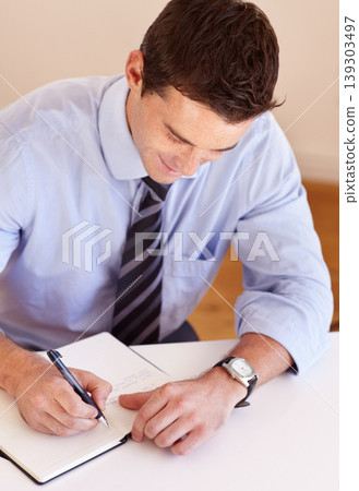 Businessman at desk with pen, notebook and smile, thinking and market research plan at startup. Office, notes and man writing schedule, agenda or to do list in book at agency with ideas for project. Businessman at desk with pen, notebook and smile, thinking and market research plan at startup. Office, notes and man writing schedule, agenda or to do list in book at agency with ideas for project. 139303497