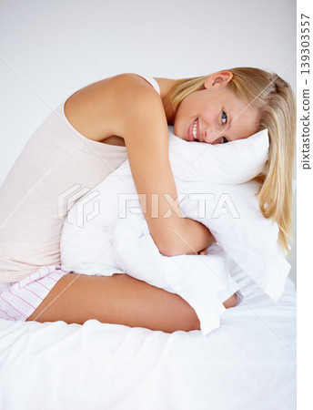 Person, portrait or hugging bedroom pillow in house for relax, break or weekend rest. Smile, happy or morning woman in pajamas embracing hospitality bedding in hotel, home and comfortable apartment Person, portrait or hugging bedroom pillow in house for relax, break or weekend rest. Smile, happy or morning woman in pajamas embracing hospitality bedding in hotel, home and comfortable apartment 139303557