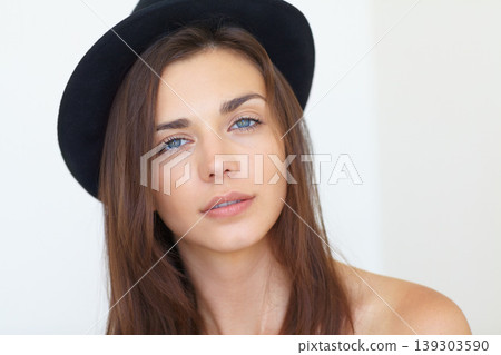 Attractive woman, portrait and face in fashion, beauty or cool style with hat against a white studio background. Gorgeous young female person or model looking with blue eyes and long hair on mockup 139303590