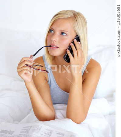 Phone call, newspaper and woman with connection, thinking and internet with communication, home and information. Person, apartment and girl with smartphone, contact and bedroom with ideas or planning 139303681
