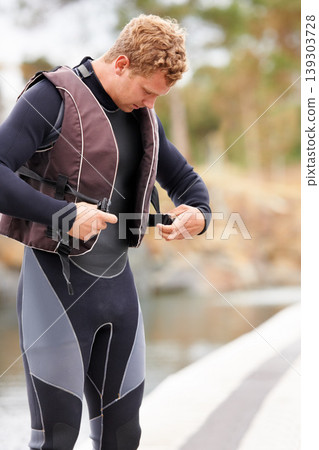 Man, ready and life jacket at lake, outdoor and extreme sports for fitness, exercise and workout. Person, happy and outdoor by river, nature and float with thinking, health and start summer training Man, ready and life jacket at lake, outdoor and extreme sports for fitness, exercise and workout. Person, happy and outdoor by river, nature and float with thinking, health and start summer training 139303728