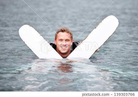 Man, water ski and portrait in lake, smile and waiting for tow with fitness, extreme sports or exercise. Person, happy and outdoor in river, nature and float with swimming, health and summer training Man, water ski and portrait in lake, smile and waiting for tow with fitness, extreme sports or exercise. Person, happy and outdoor in river, nature and float with swimming, health and summer training 139303766