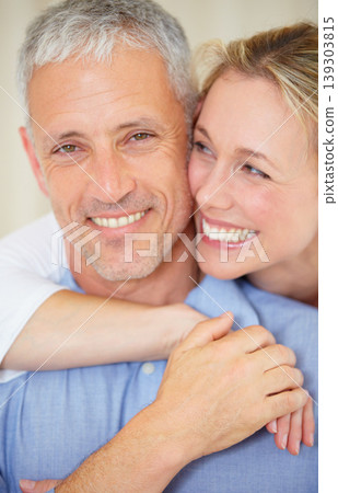 Happy couple, portrait and hug for love, support or care in romance together on holiday weekend at home. Face of mature married woman hugging man with smile in embrace, bonding or honeymoon at house Happy couple, portrait and hug for love, support or care in romance together on holiday weekend at home. Face of mature married woman hugging man with smile in embrace, bonding or honeymoon at house 139303815