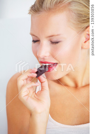 Relax woman face, eating and enjoy chocolate bar, delicious snack or studio wellness candy, junk food or dessert product. Diet nutrition, sugar addiction temptation or female person bite cacao sweets Relax woman face, eating and enjoy chocolate bar, delicious snack or studio wellness candy, junk food or dessert product. Diet nutrition, sugar addiction temptation or female person bite cacao sweets 139303856