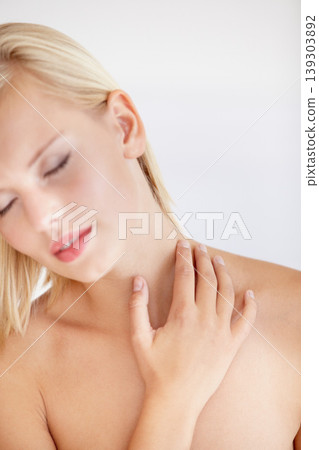 Girl, skincare and touch with eyes closed in studio for wellness, beauty or health by white background. Woman, model and peace with cosmetics for neck, change and transformation for natural glow Girl, skincare and touch with eyes closed in studio for wellness, beauty or health by white background. Woman, model and peace with cosmetics for neck, change and transformation for natural glow 139303892