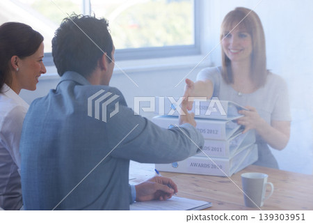 Woman, employer and handshake in interview for welcome, onboarding and hiring in office or workplace. Business, professional and people with documents, paperwork or shaking hands in meeting or smile Woman, employer and handshake in interview for welcome, onboarding and hiring in office or workplace. Business, professional and people with documents, paperwork or shaking hands in meeting or smile 139303951