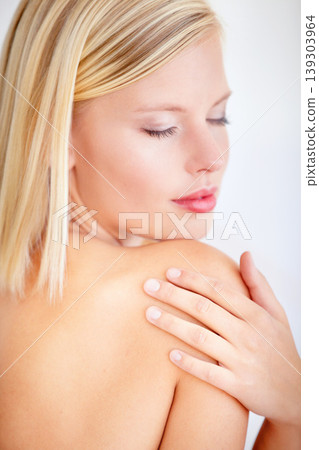 Woman, skincare and touch with eyes closed in studio for wellness, beauty or health by white background. Girl, model and peace with touch for skin, cosmetic change and transformation for natural glow Woman, skincare and touch with eyes closed in studio for wellness, beauty or health by white background. Girl, model and peace with touch for skin, cosmetic change and transformation for natural glow 139303964
