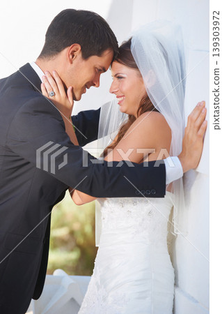 Bride, groom and wedding hug outdoor with love, care and excited for life event, union or trust. Love, happy and couple embrace outside marriage ceremony with support, security and excited for future Bride, groom and wedding hug outdoor with love, care and excited for life event, union or trust. Love, happy and couple embrace outside marriage ceremony with support, security and excited for future 139303972
