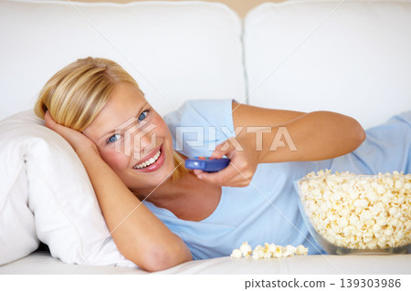 Portrait, home and watching tv with woman, popcorn and remote with happiness, relax and cheerful. Face, person and girl on a sofa, snack and streaming a movie with joy, film or comedy with television Portrait, home and watching tv with woman, popcorn and remote with happiness, relax and cheerful. Face, person and girl on a sofa, snack and streaming a movie with joy, film or comedy with television 139303986