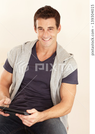 Portrait, man and tablet in studio for social media, download news app and streaming multimedia on white background. Happy guy, digital technology and scroll for online shopping, subscription or blog Portrait, man and tablet in studio for social media, download news app and streaming multimedia on white background. Happy guy, digital technology and scroll for online shopping, subscription or blog 139304015